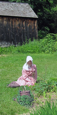 Weeding the garden in a bonnet. No need for sun screen here. 